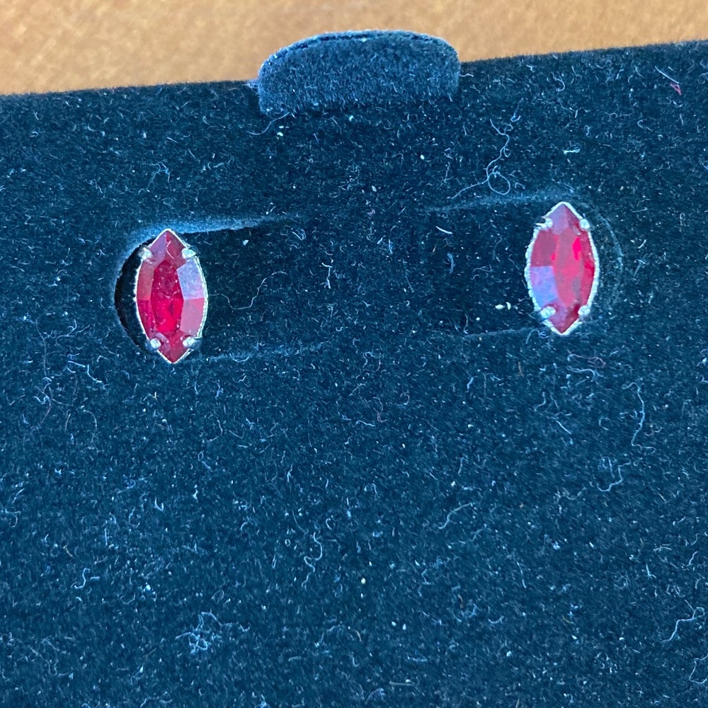 Red gem and silver stud earrings